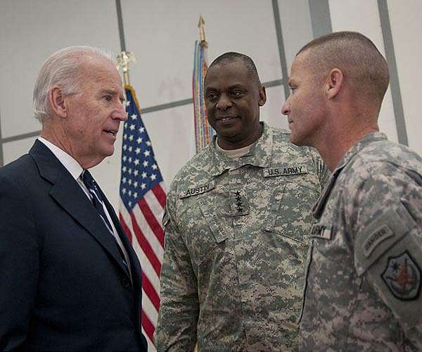 Disappearing defense chief puts Biden under fire