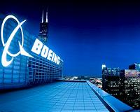 Boeing profits surge but tougher 2014 awaits