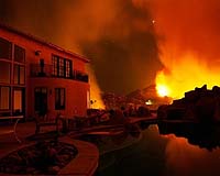 Firefighters beat back Malibu fire as winds calm