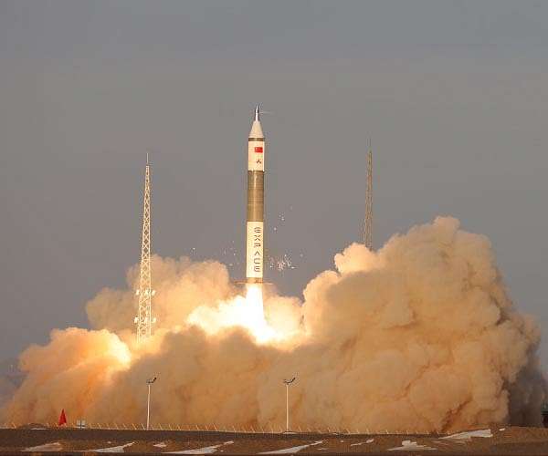 China launches carrier rocket to deploy experimental cargo ship and satellite