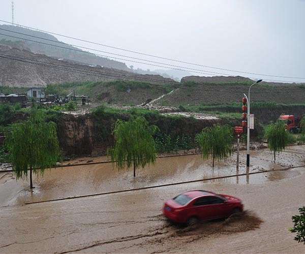 Four dead in China flash flood; 11 died in Gambia's worst floods in decades
