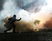 In buckets and gardening gloves, Iraqis dress for tear gas