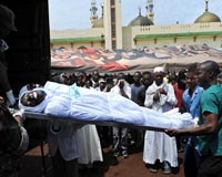 Burkina leader seeks way out of crisis after Guinea massacre