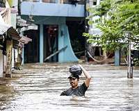 Indonesia braces for more downpours as flood toll hits 66