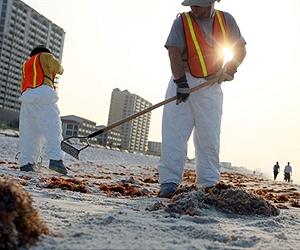 A few patches of tar empty Biloxi's white sand beaches