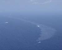 Japan confirms oil from wrecked tanker hitting its beaches