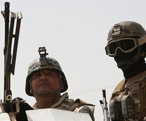 Iraqi officer killed as figures show violence down
