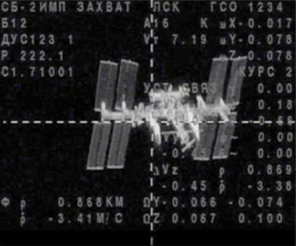 Russian ship docks with ISS to replace damaged capsule