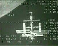 Russian capsule carrying US tourist docks with space station