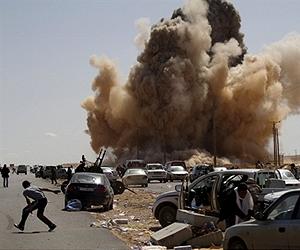 Kadhafi tanks pound rebel city ahead of son's funeral