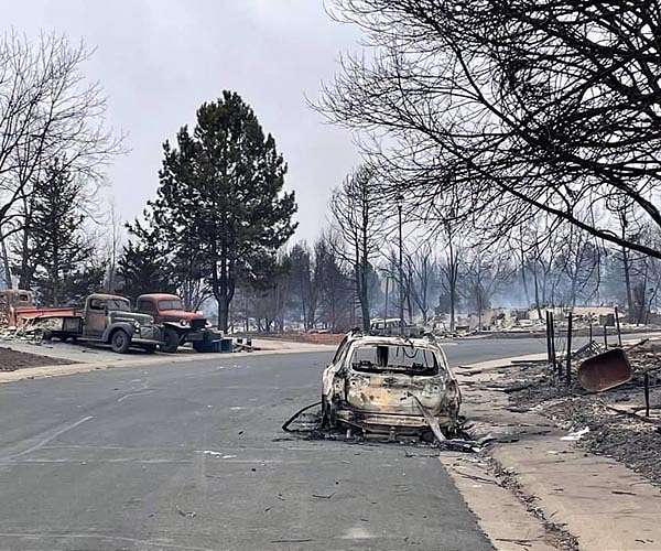 One dead in Colorado blaze as fires ravage US west