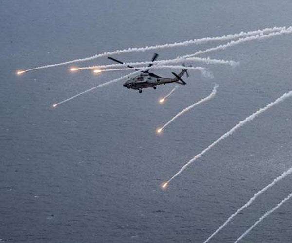 Russian ship's crew fired signal flares toward German helicopter