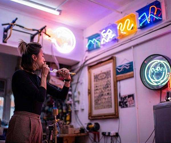 Hong Kong's young 'neon nomads' keep dying trade flickering