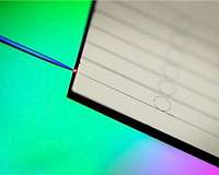 Optical communication using solitons on a photonic chip