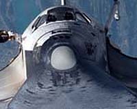 Debris visible as shuttle Endeavour blasts into space