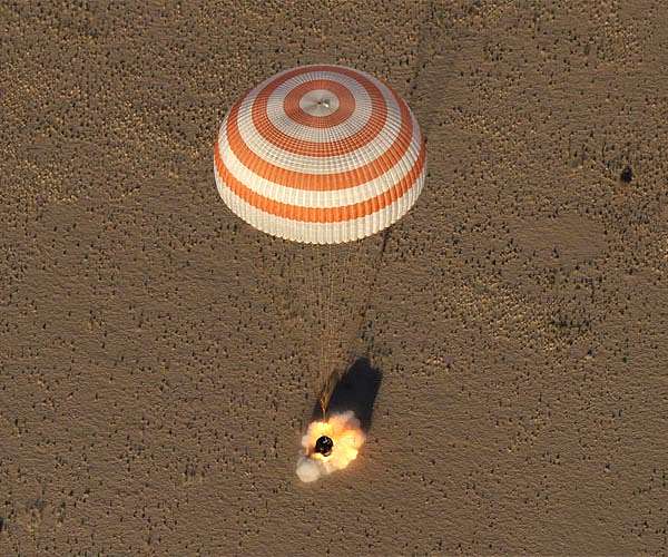 Three-man US-Russian crew returns to Earth from ISS