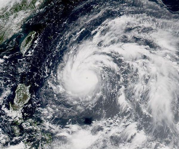 Villagers flee fresh floods in central China as typhoon approaches