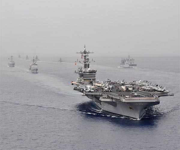 China says US should take lead in military cuts after Trump comments